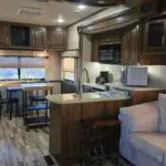 kitchen sink countertop and nook areas for eating.