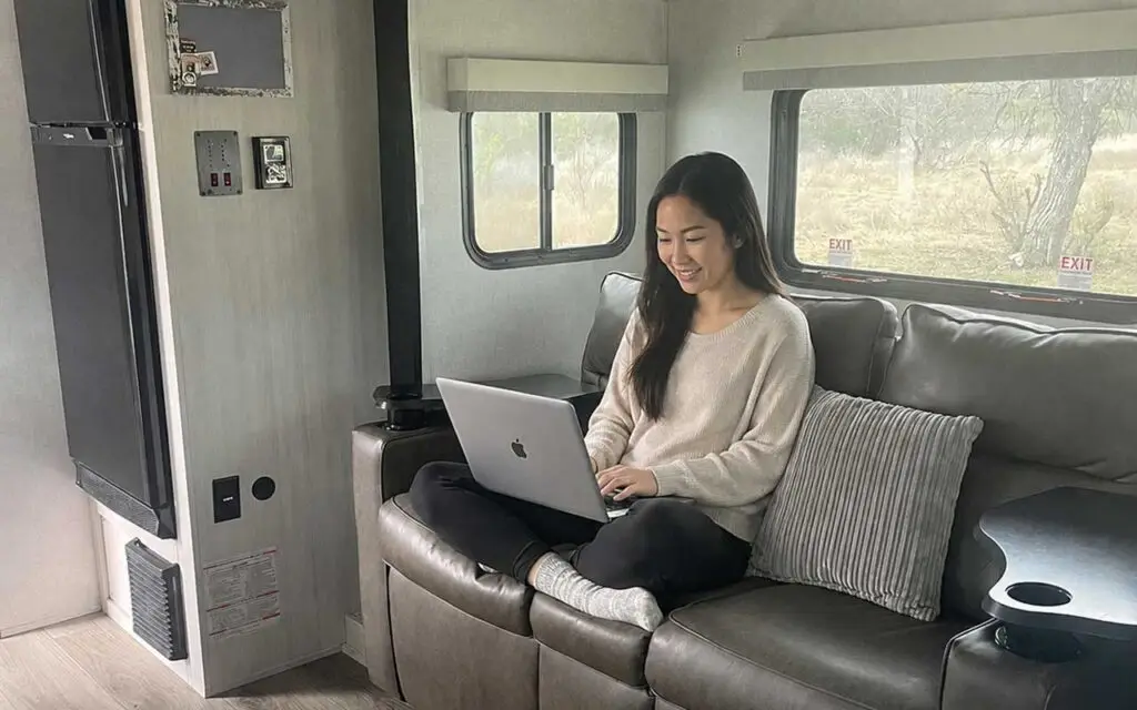 Guest working remotely from a Cozy Pod rental at Pitmaster RV Park in Concan, Texas near Garner State Park