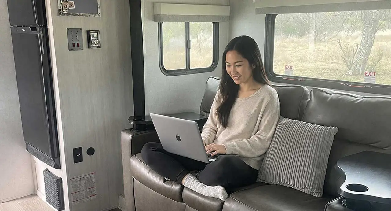 Guest working remotely from a Cozy Pod rental at Pitmaster RV Park in Concan, Texas near Garner State Park